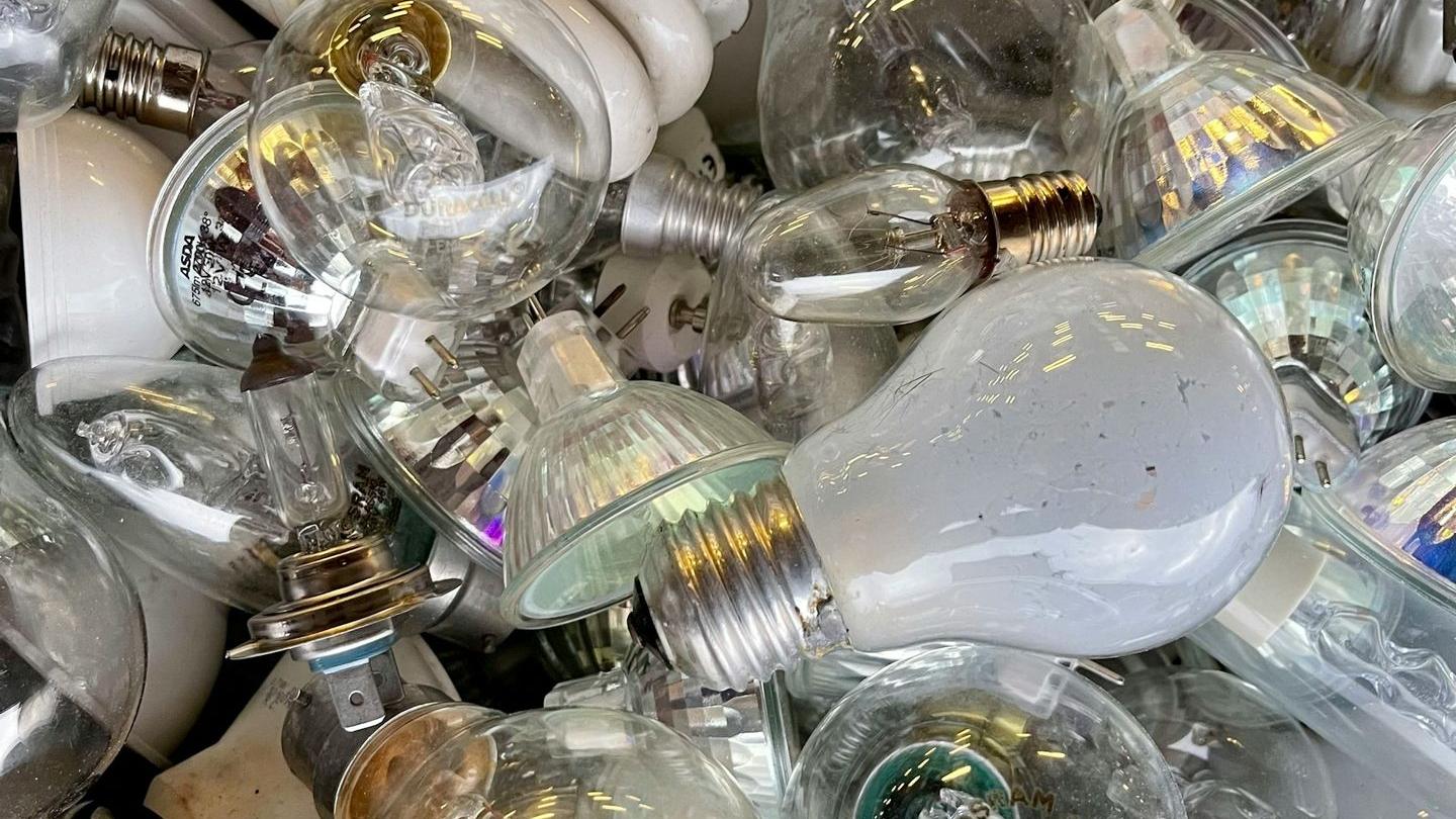 a pile of light bulbs sitting on top of each other